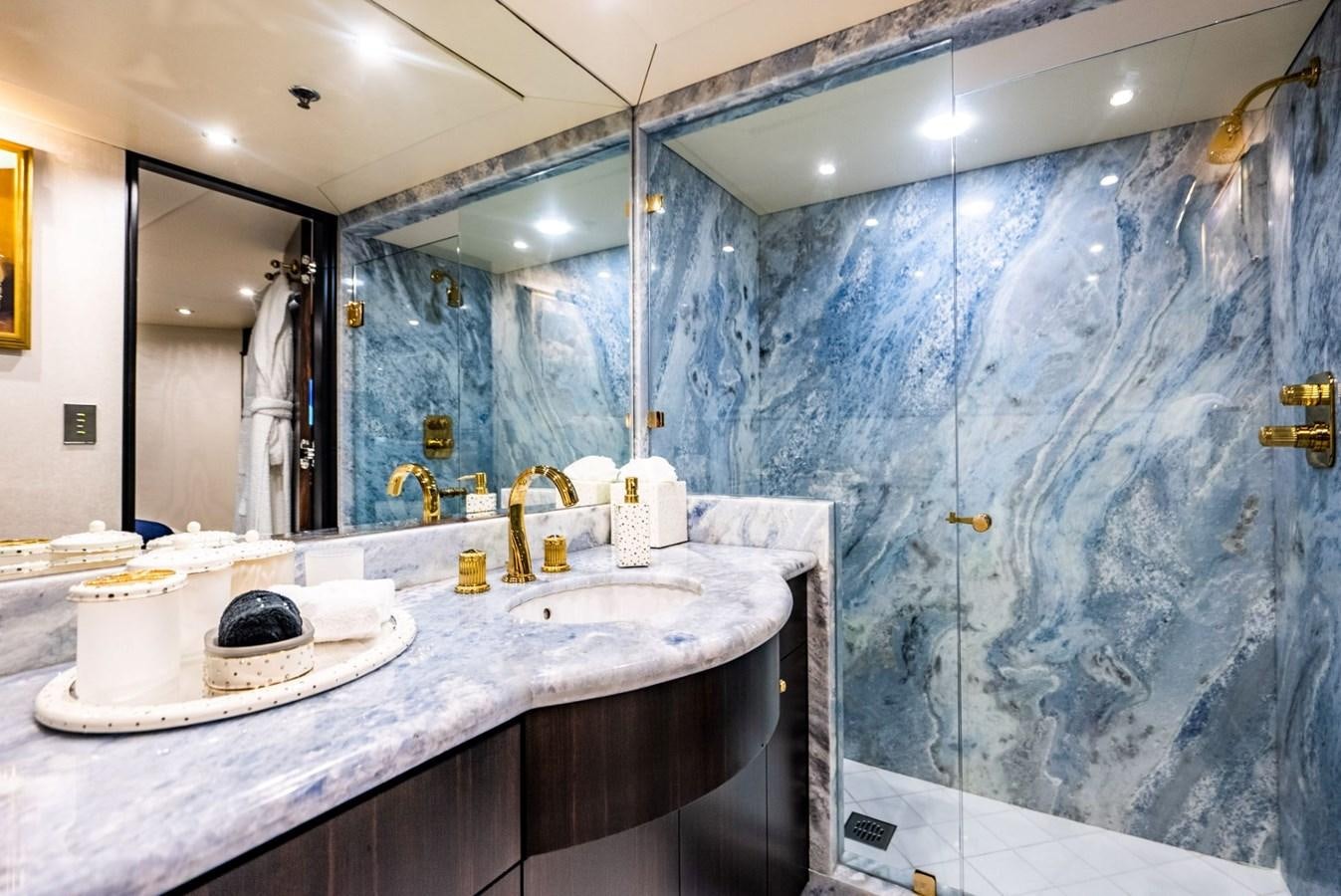 a bathroom with a large marble countertop aboard GRADE I Yacht for Charter