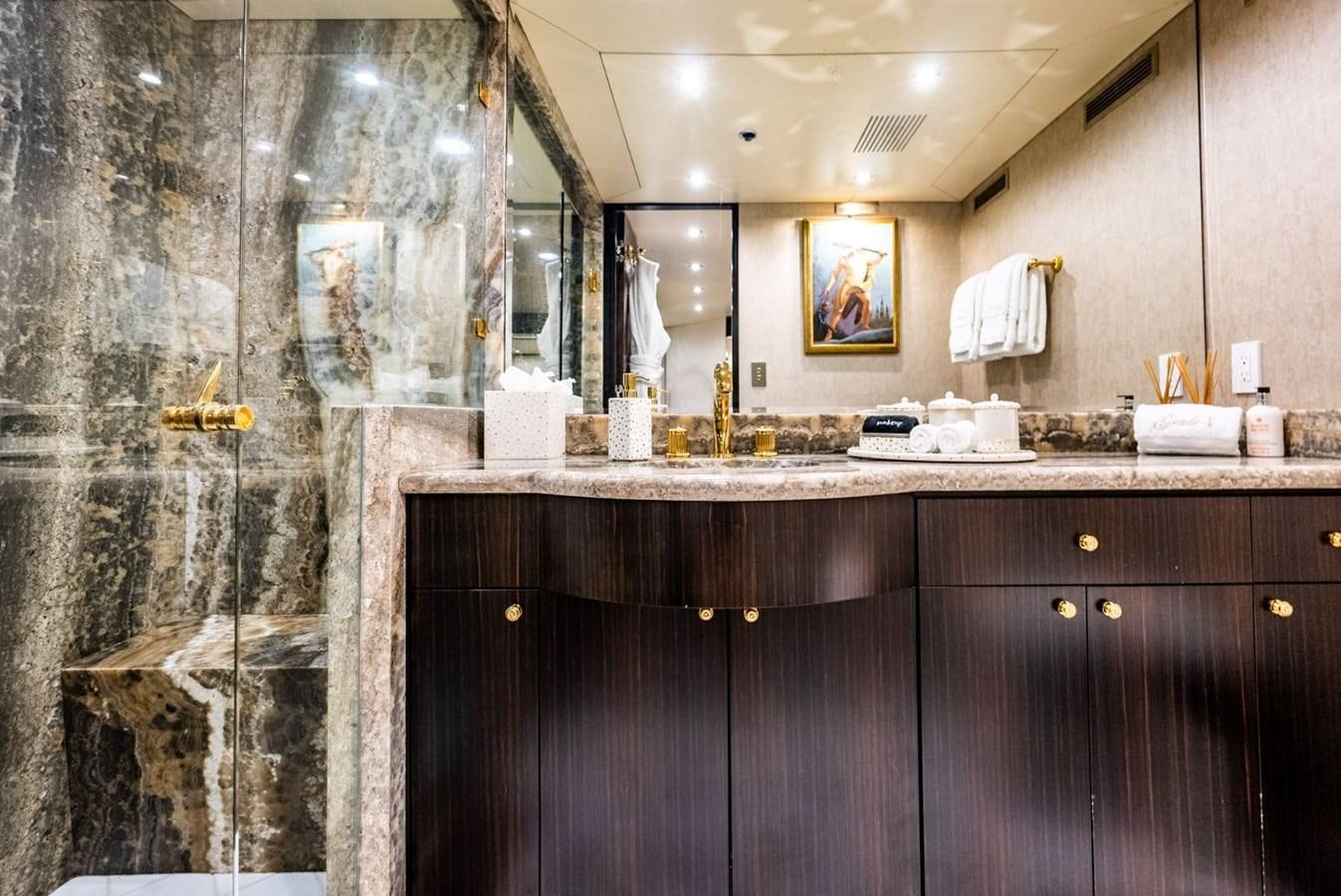 a bathroom with a marble counter top aboard GRADE I Yacht for Charter