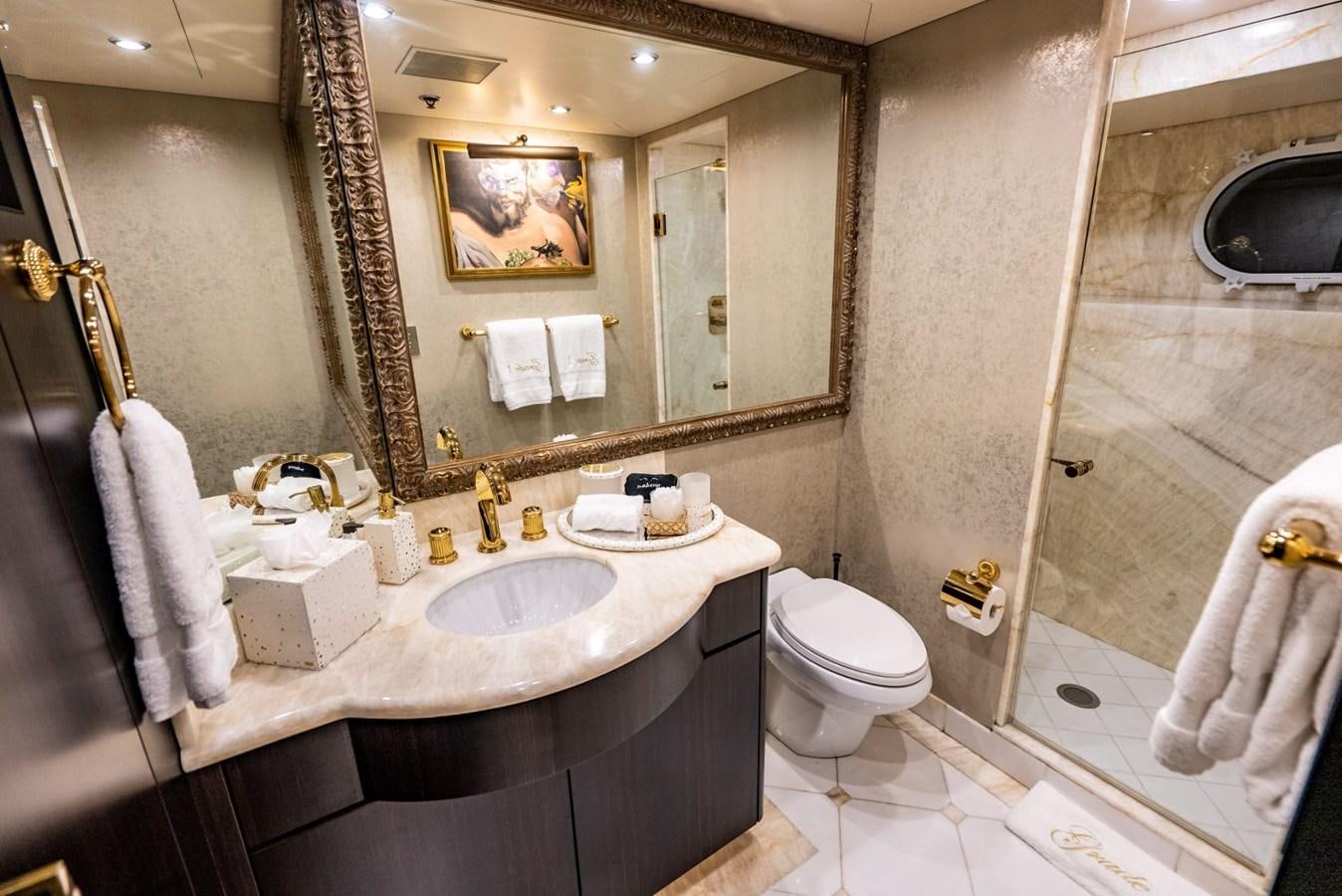a bathroom with a large mirror aboard GRADE I Yacht for Charter