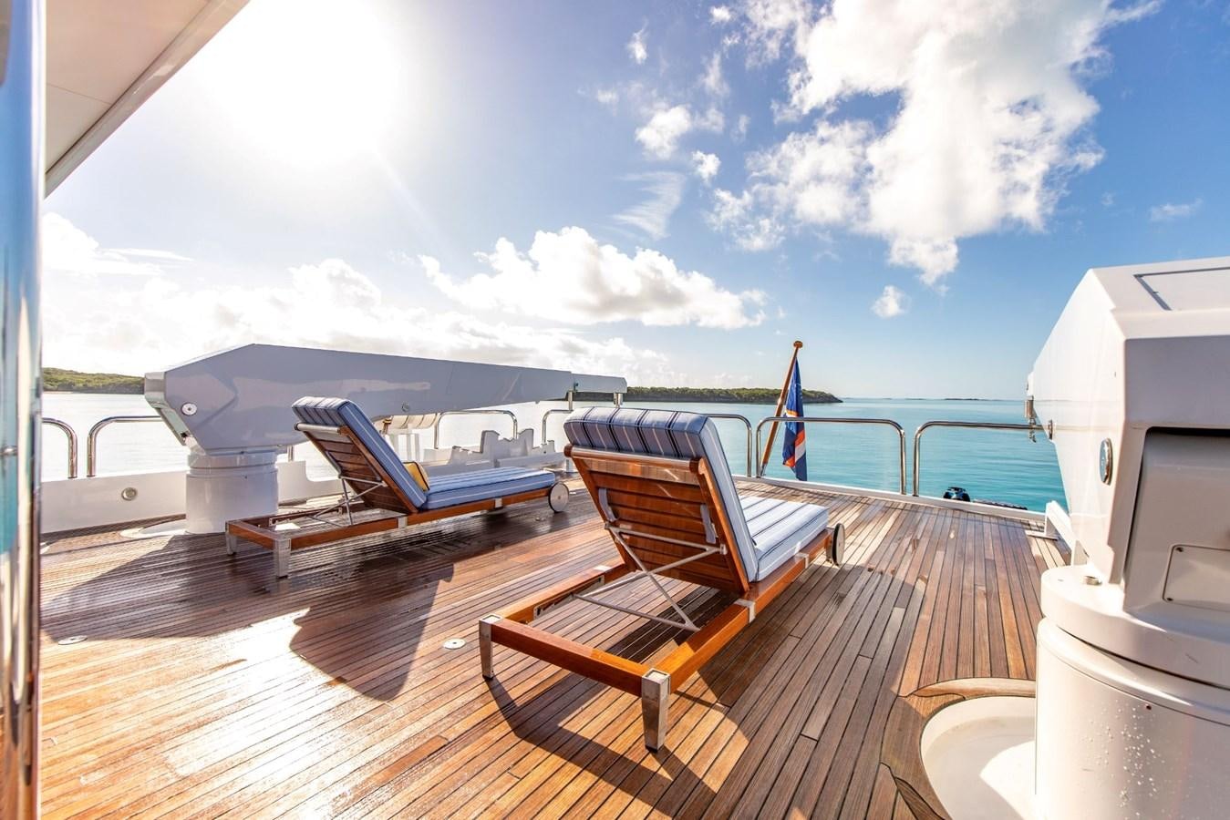 a deck with chairs on it aboard GRADE I Yacht for Charter