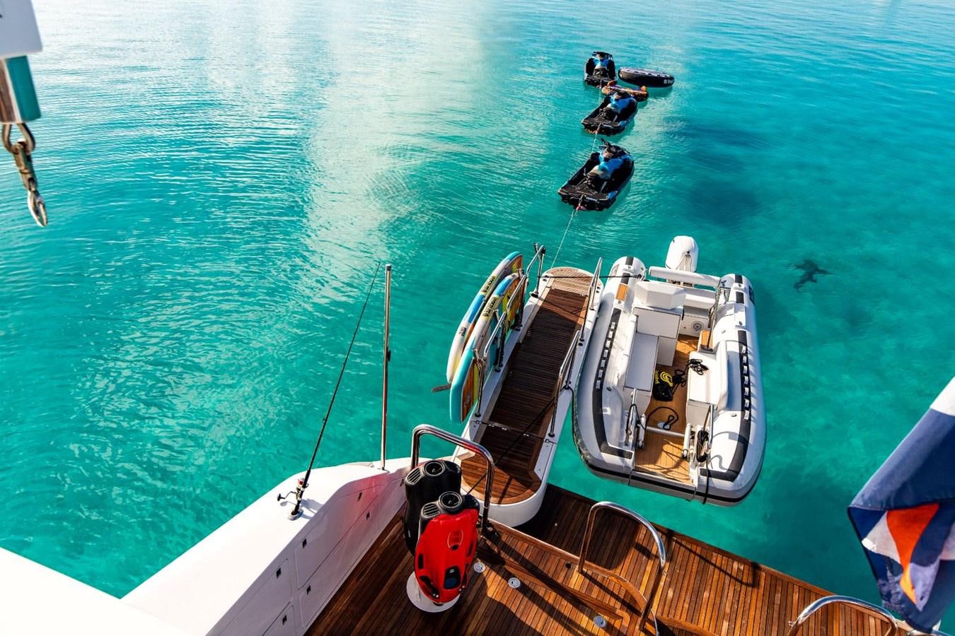 a boat with a flag on it aboard GRADE I Yacht for Charter