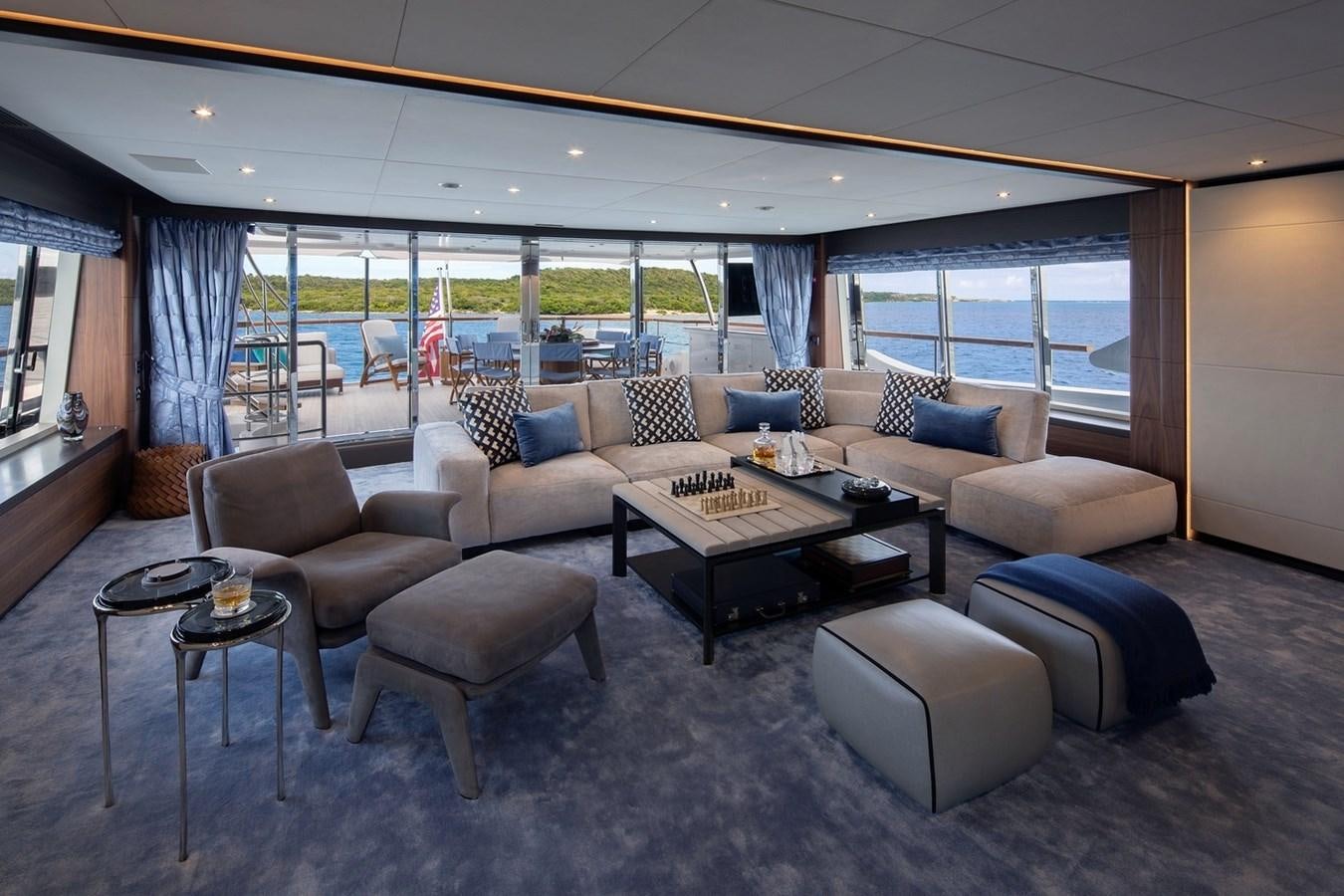 a living room with a large window aboard JODI ANN Yacht for Charter