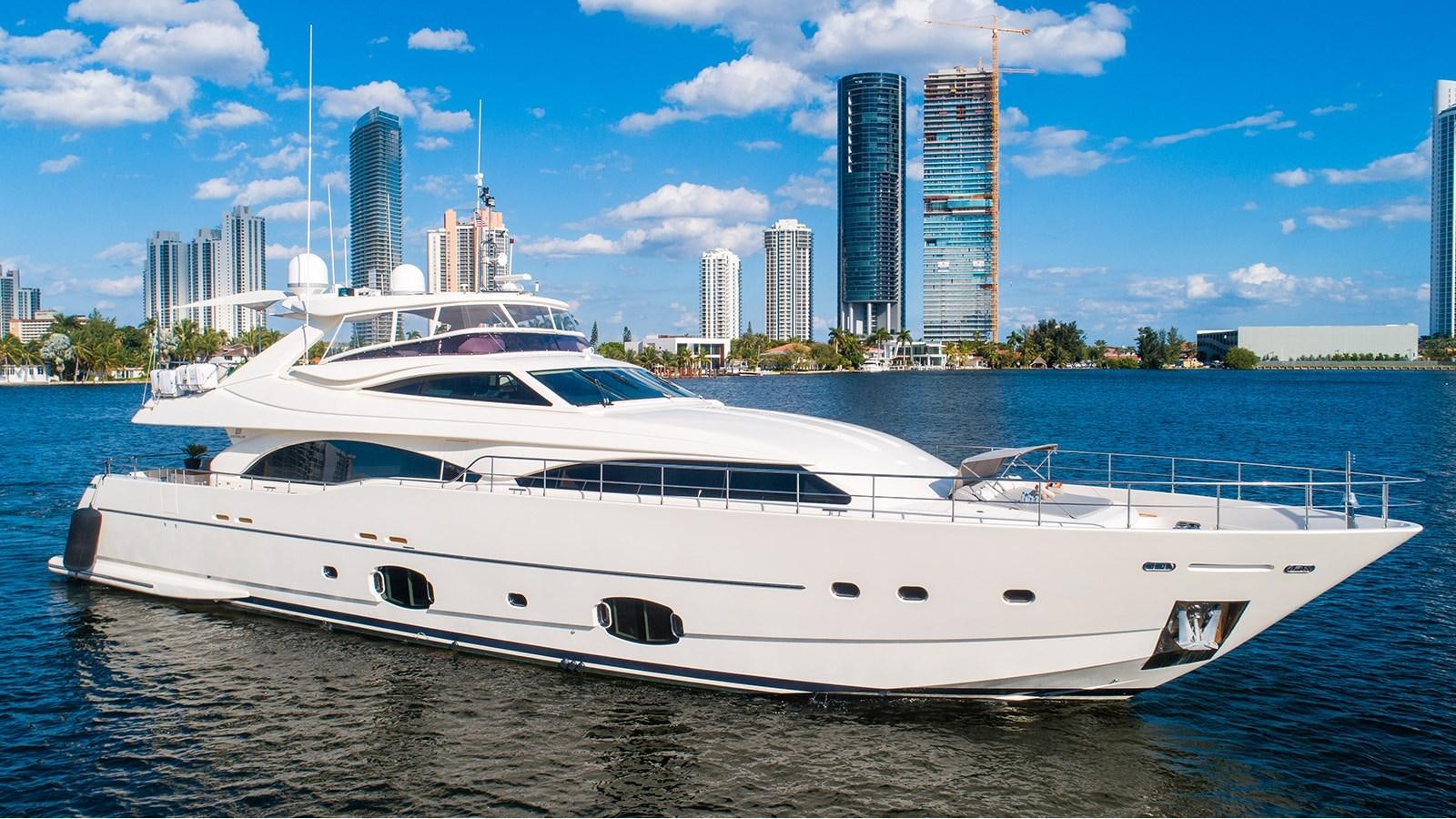 a white yacht on a beach aboard PATRON Yacht for Sale