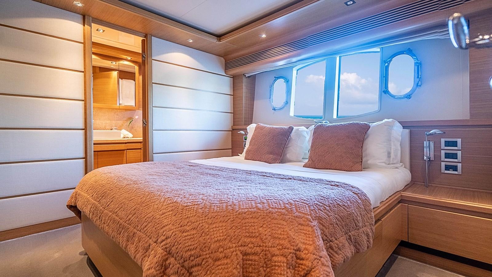 a bed in a room aboard PATRON Yacht for Sale
