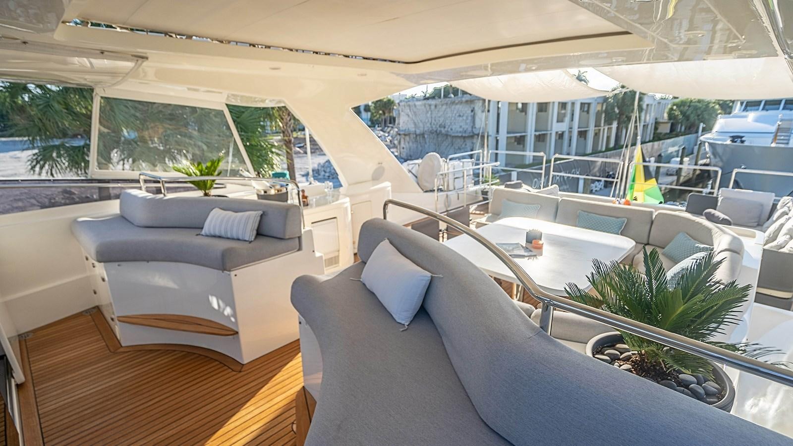 a room with a couch and a pool aboard PATRON Yacht for Sale