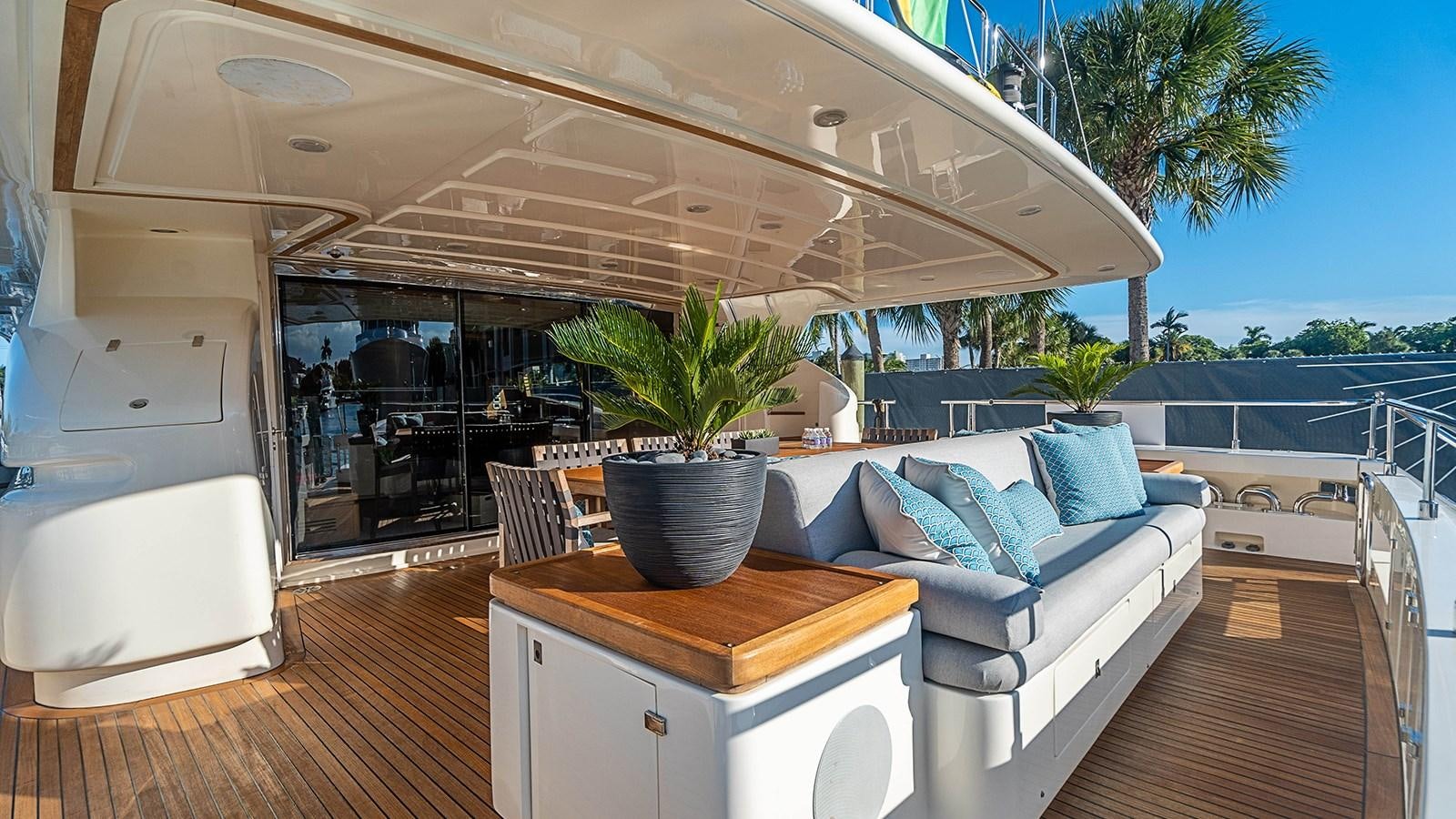 a living room with a large patio aboard PATRON Yacht for Sale