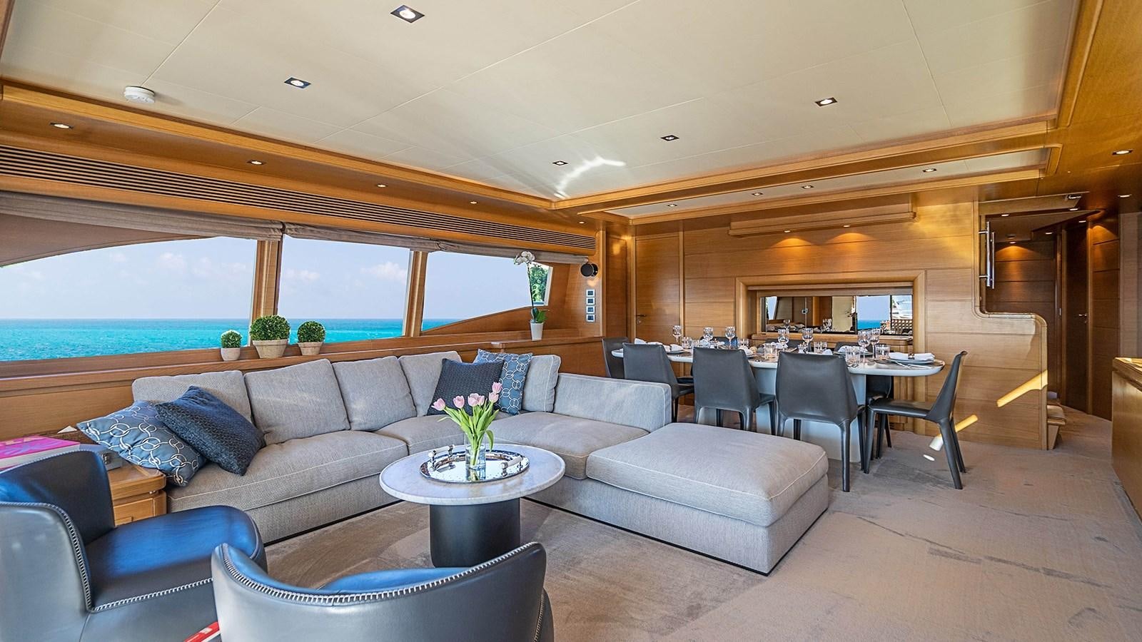 a living room with a couch and a table aboard PATRON Yacht for Sale