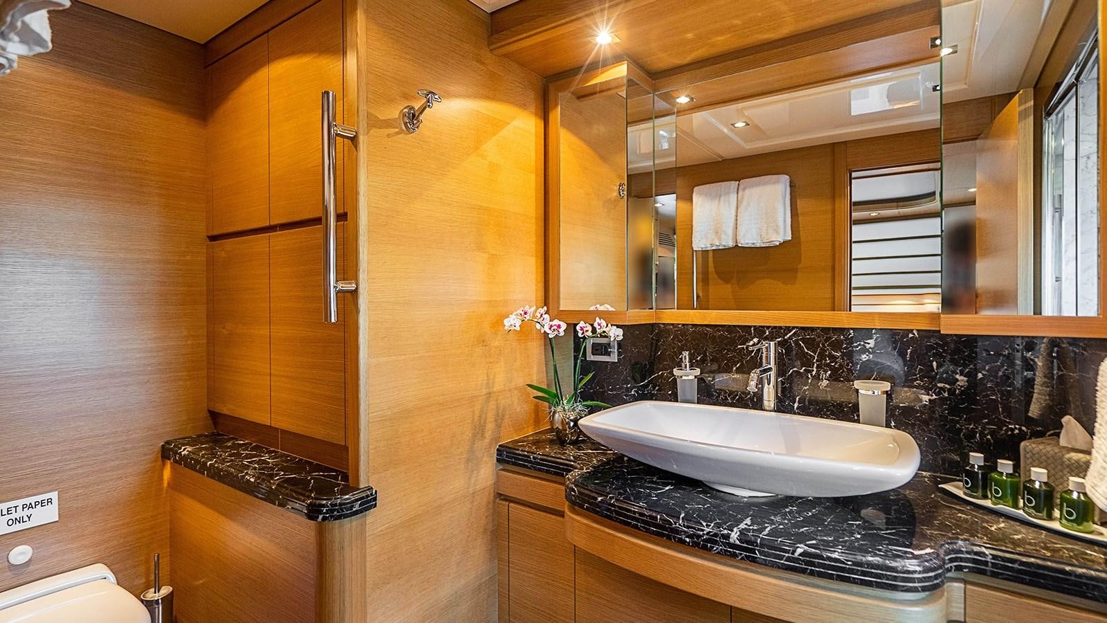 a bathroom with a sink and a mirror aboard PATRON Yacht for Sale