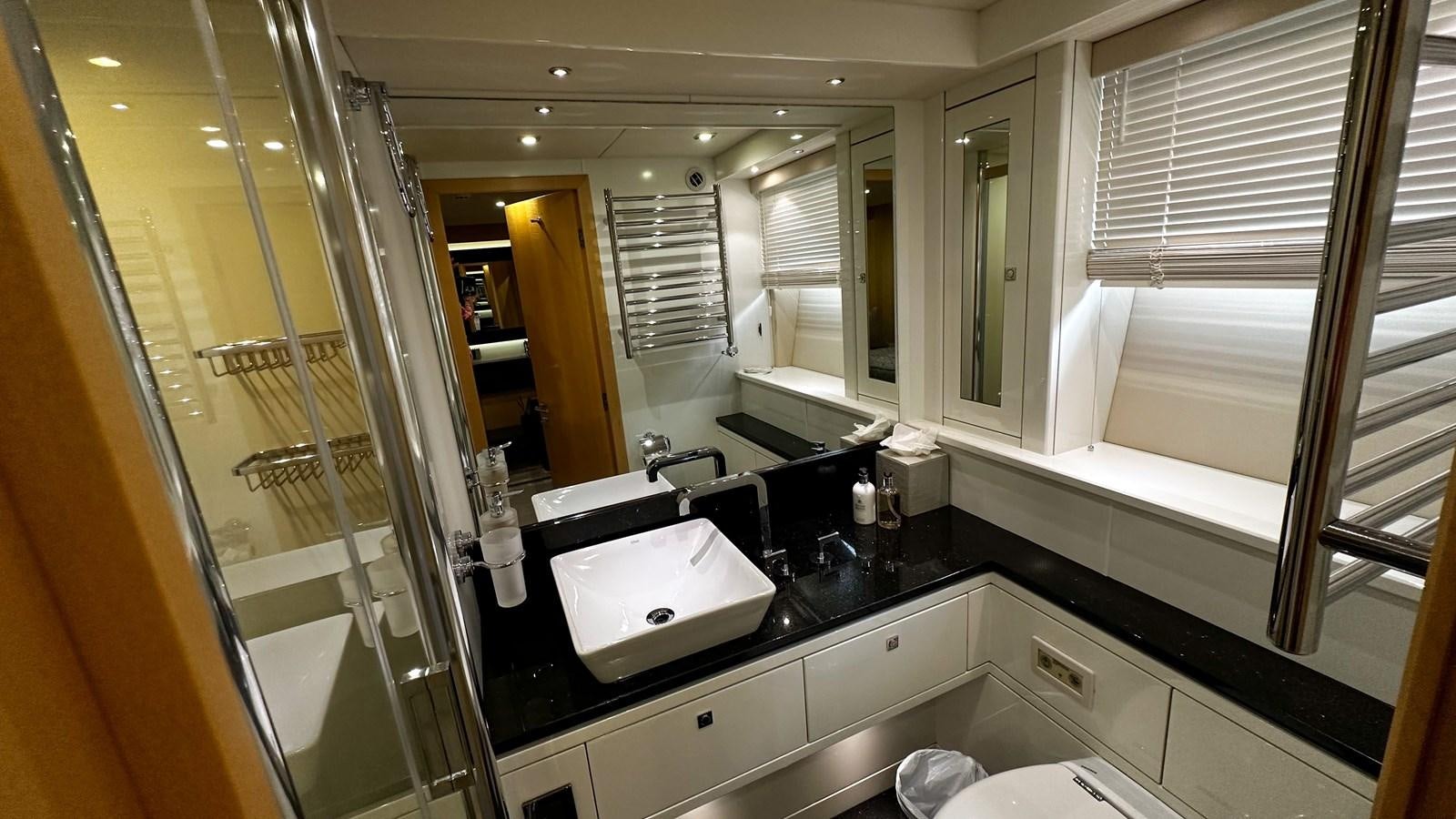 a bathroom with a large mirror aboard SOFI V Yacht for Sale