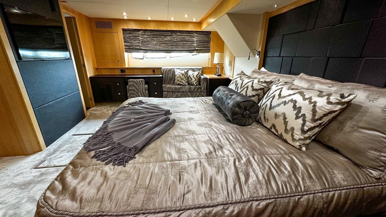a bed with pillows on it aboard SOFI V Yacht for Sale