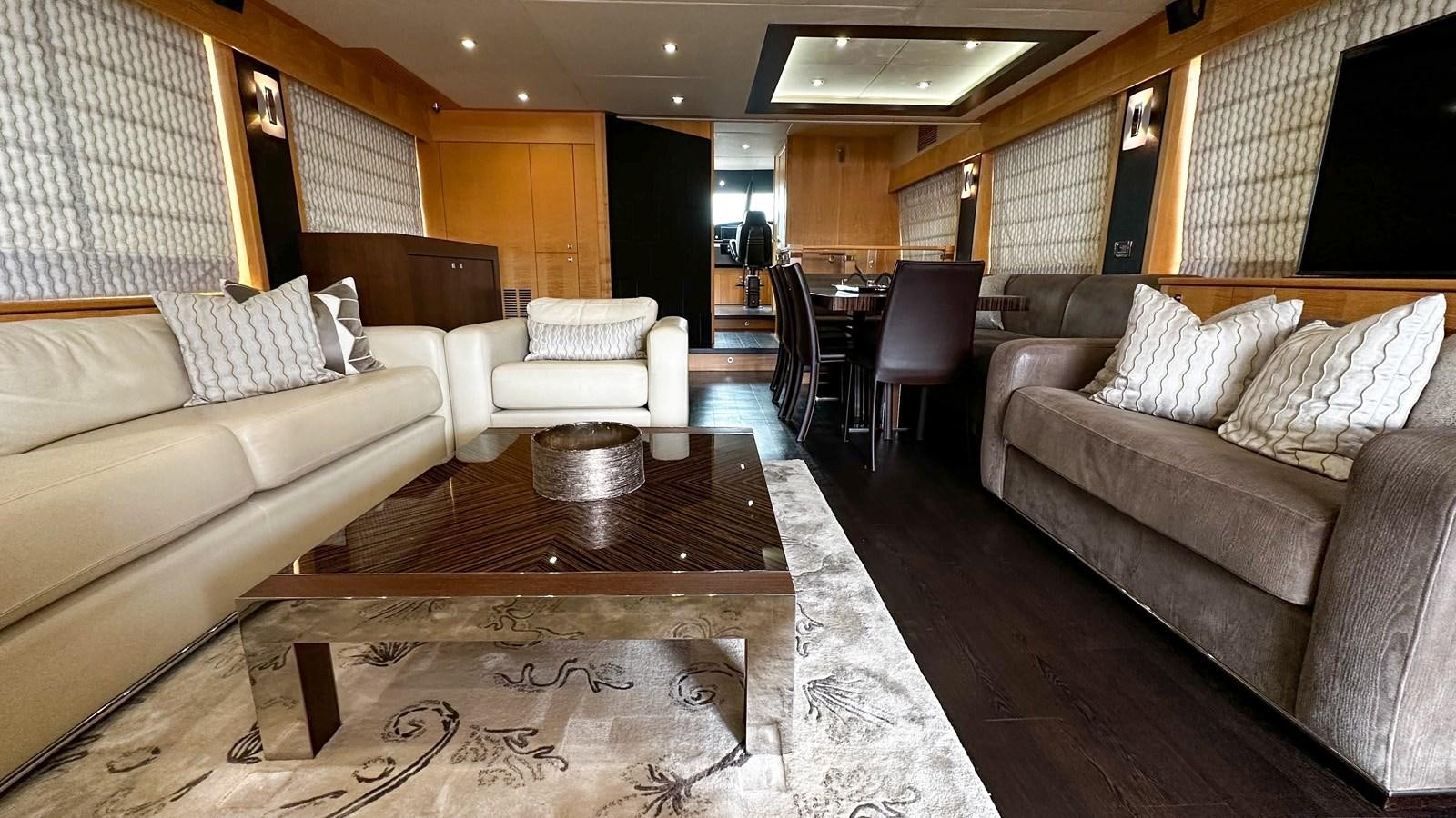 a living room with a couch and a coffee table aboard SOFI V Yacht for Sale