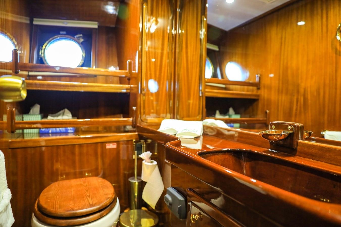 a bathroom with a toilet and sink aboard OFELIA Yacht for Sale