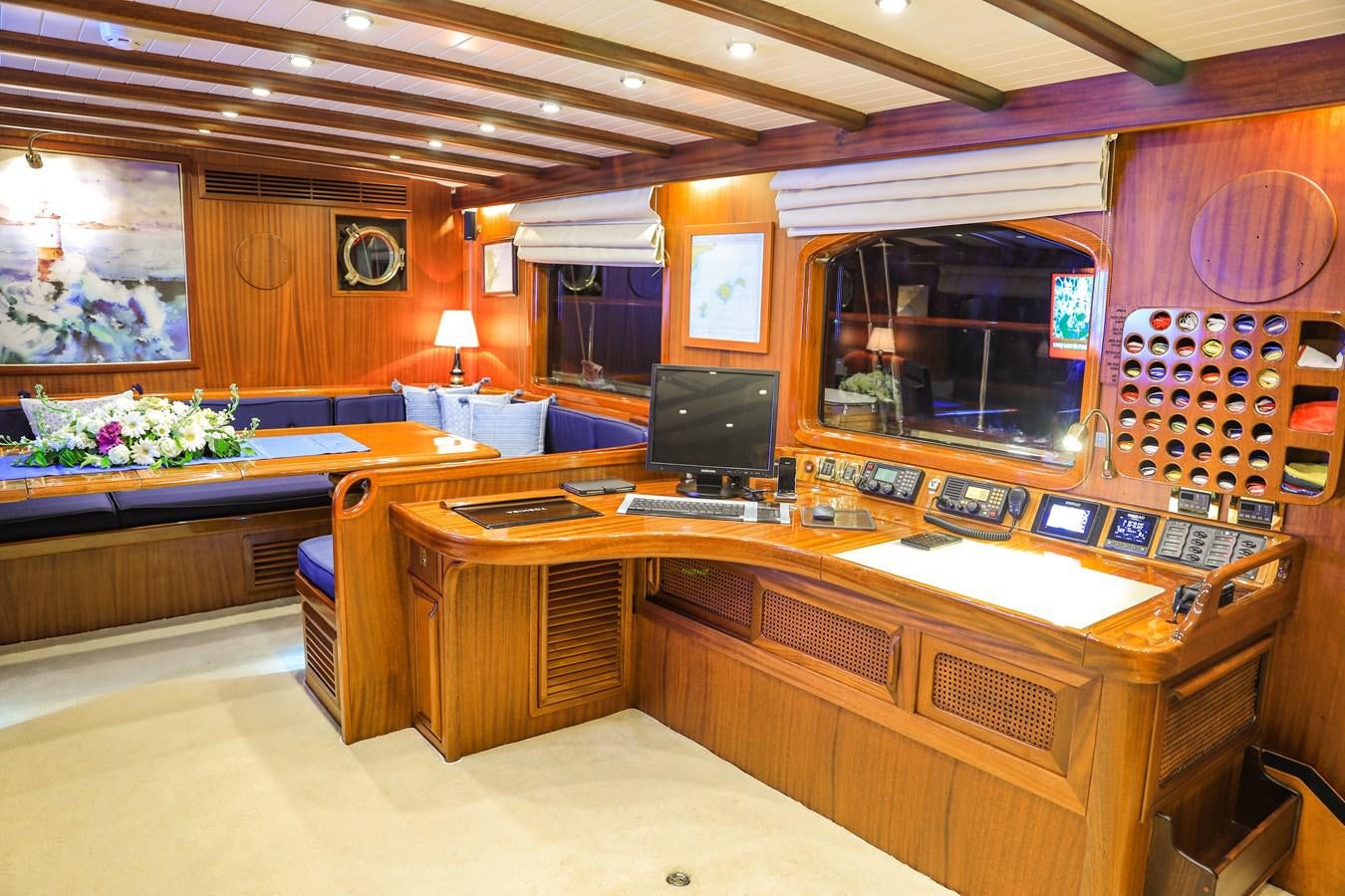 a room with a desk and a computer aboard OFELIA Yacht for Sale