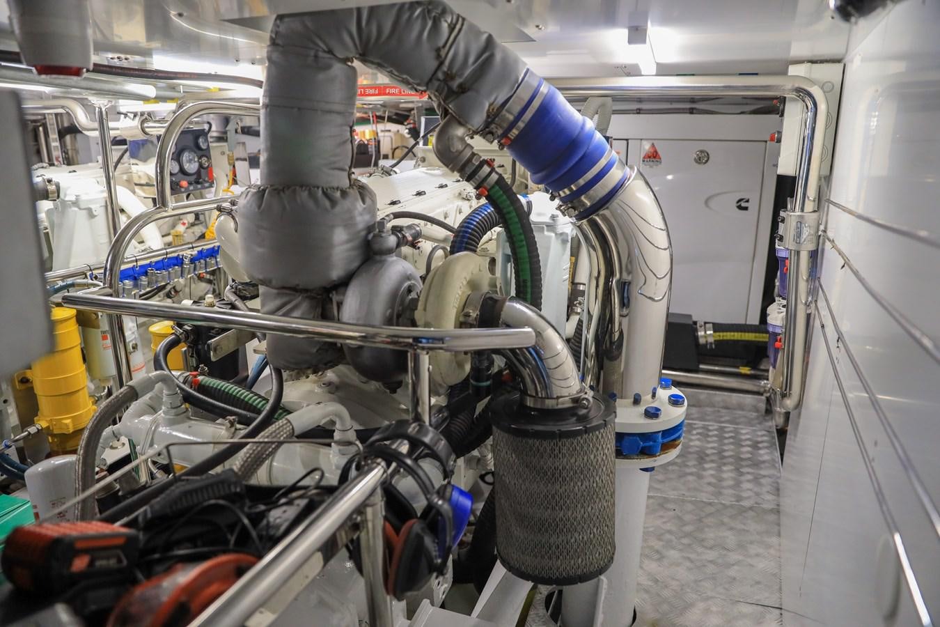 a person working on a car aboard OFELIA Yacht for Sale