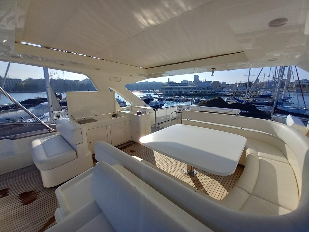 a boat with a view of the water and the city below aboard ALIN Yacht for Sale
