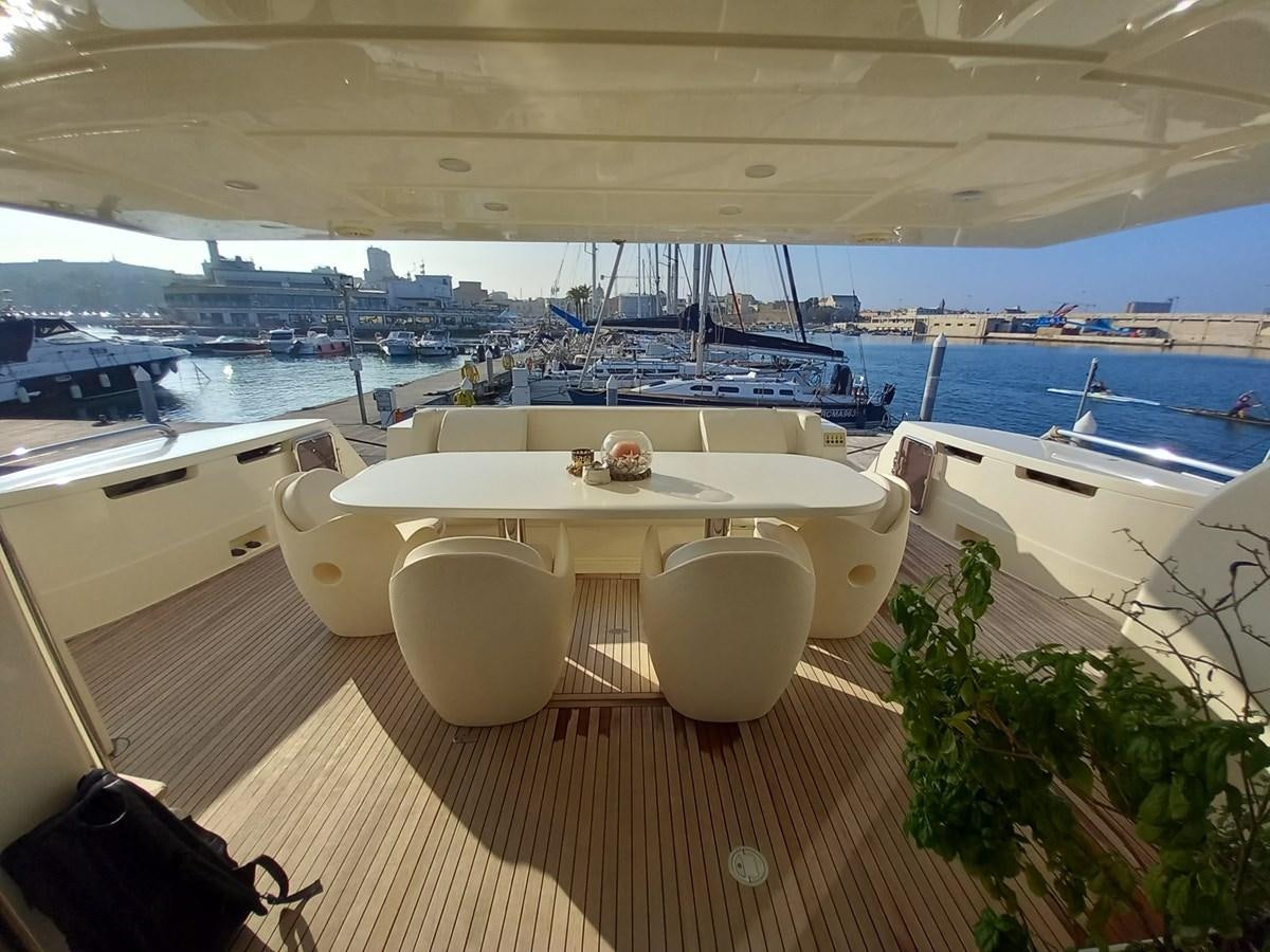 a room with a table and chairs aboard ALIN Yacht for Sale