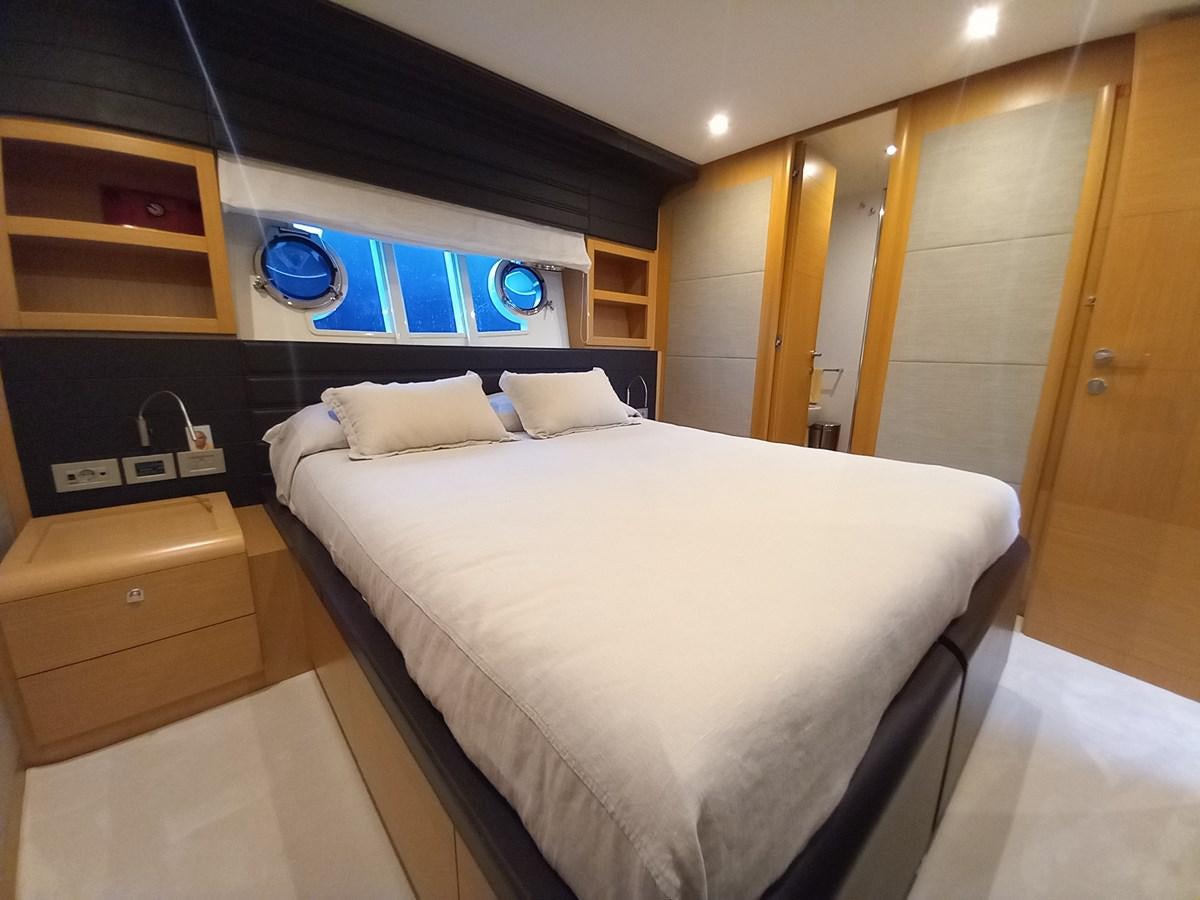 a room with a bed and a desk aboard ALIN Yacht for Sale