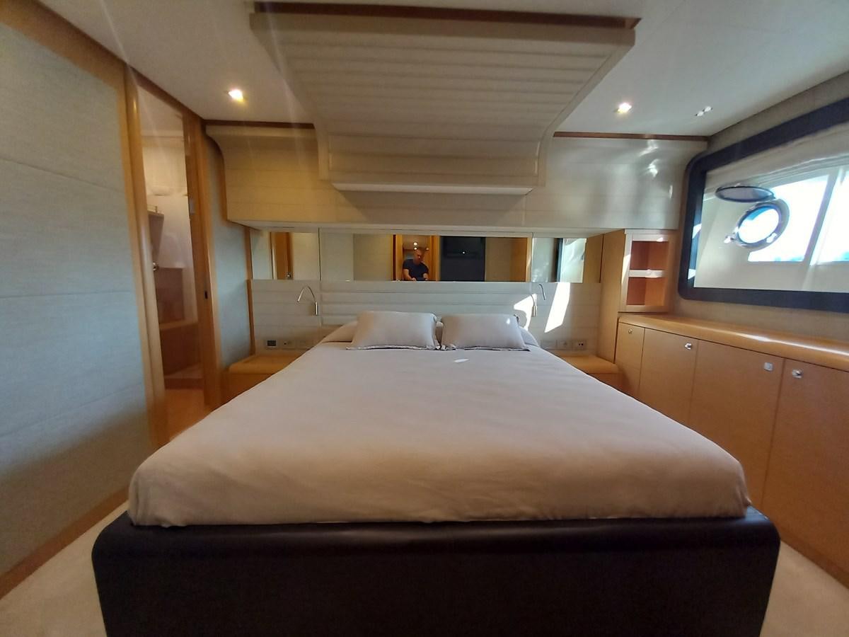 a bed with a white sheet aboard ALIN Yacht for Sale