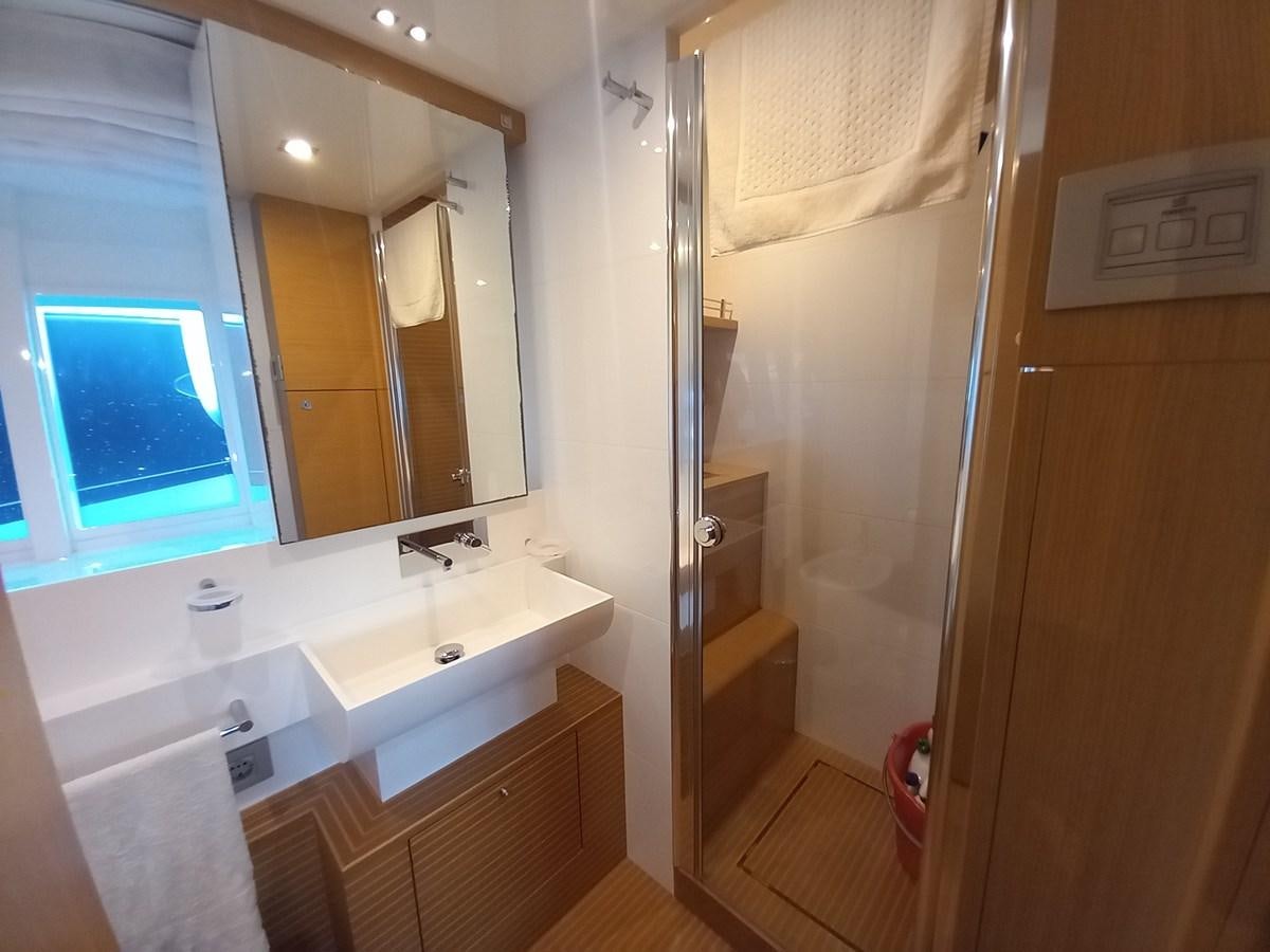 a bathroom with a large mirror aboard ALIN Yacht for Sale