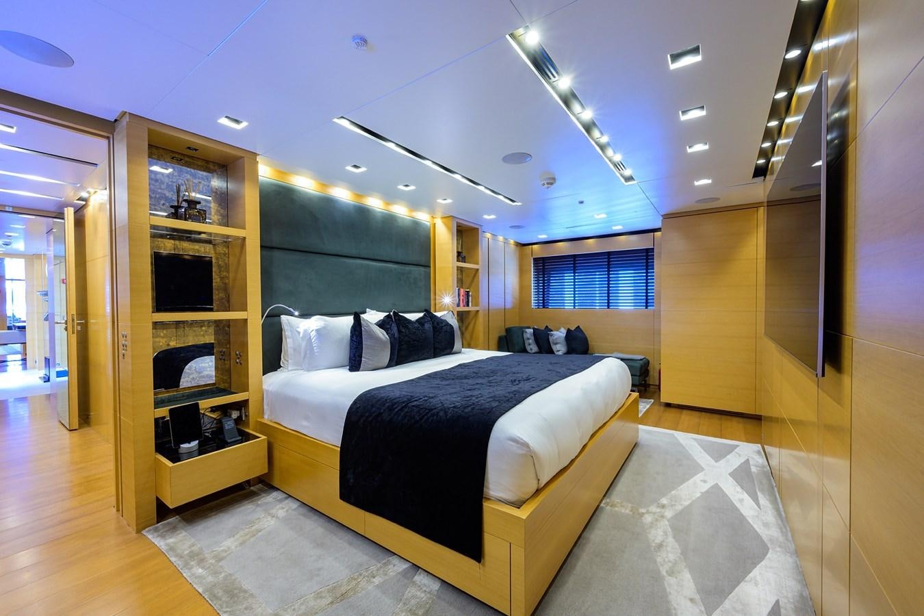 a bedroom with a large bed aboard AWAY Yacht for Charter