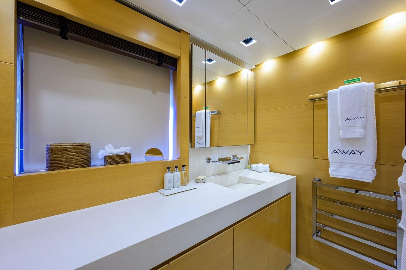 a bathroom with a large mirror aboard AWAY Yacht for Charter