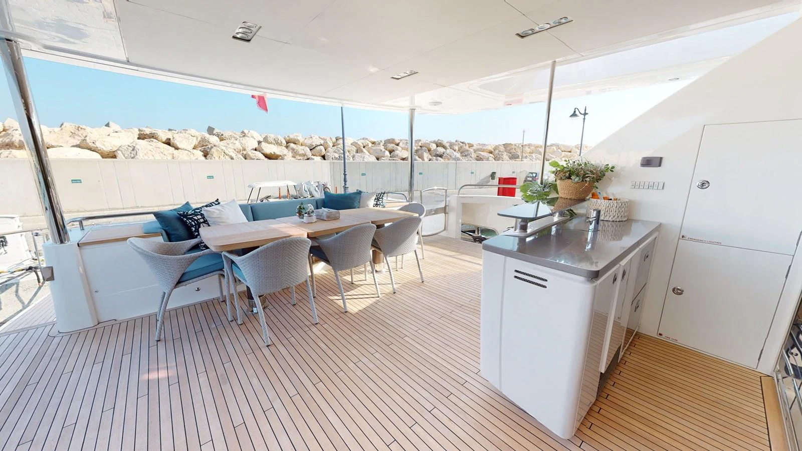 a room with tables and chairs aboard HALLELUJAH Yacht for Charter