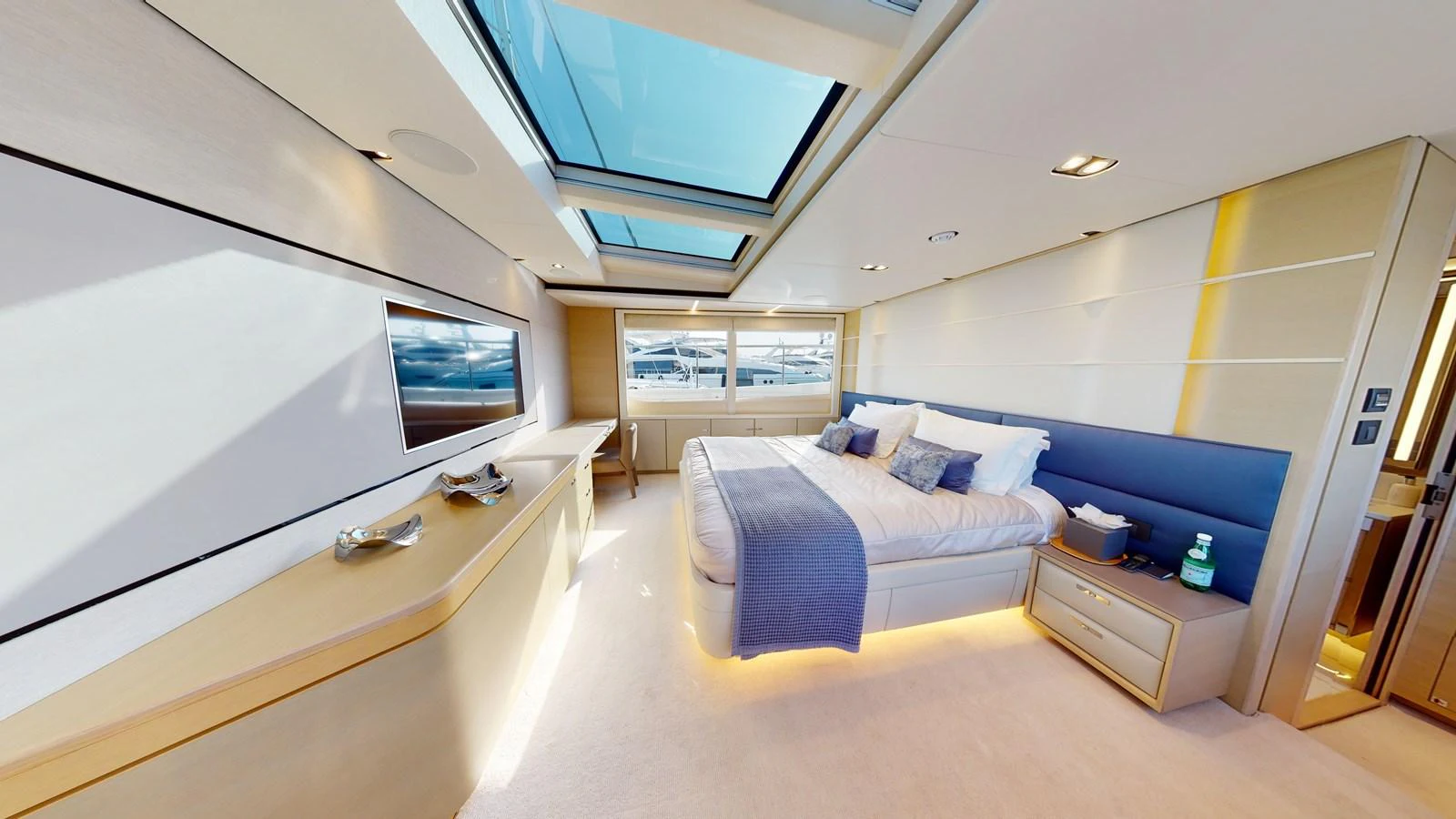 a room with a bed and a tv aboard HALLELUJAH Yacht for Charter