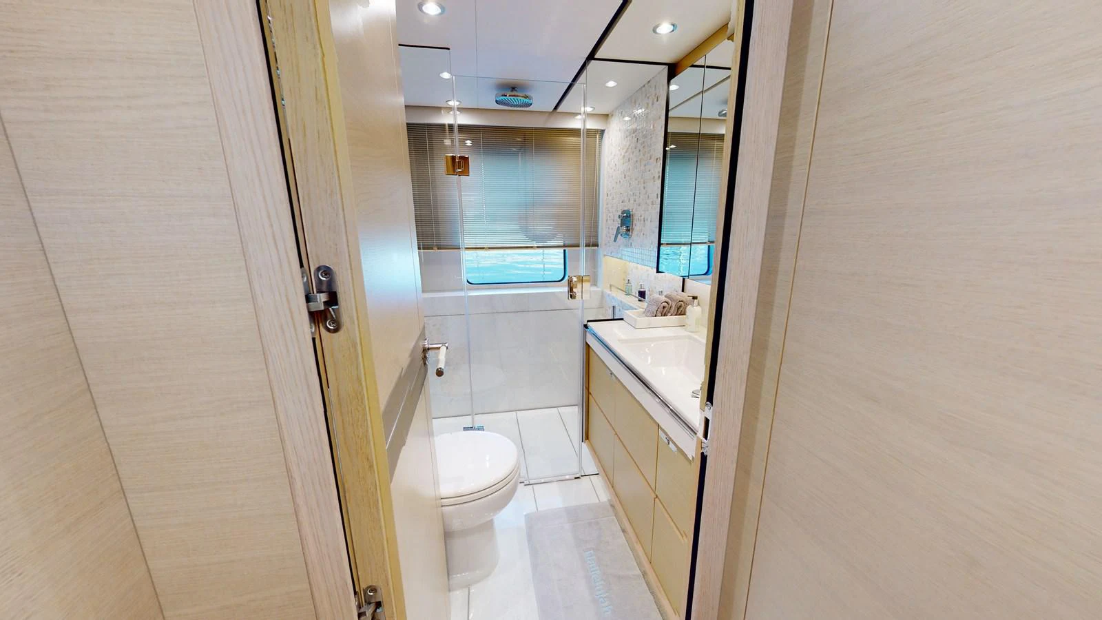 a bathroom with a toilet and a sink aboard HALLELUJAH Yacht for Charter