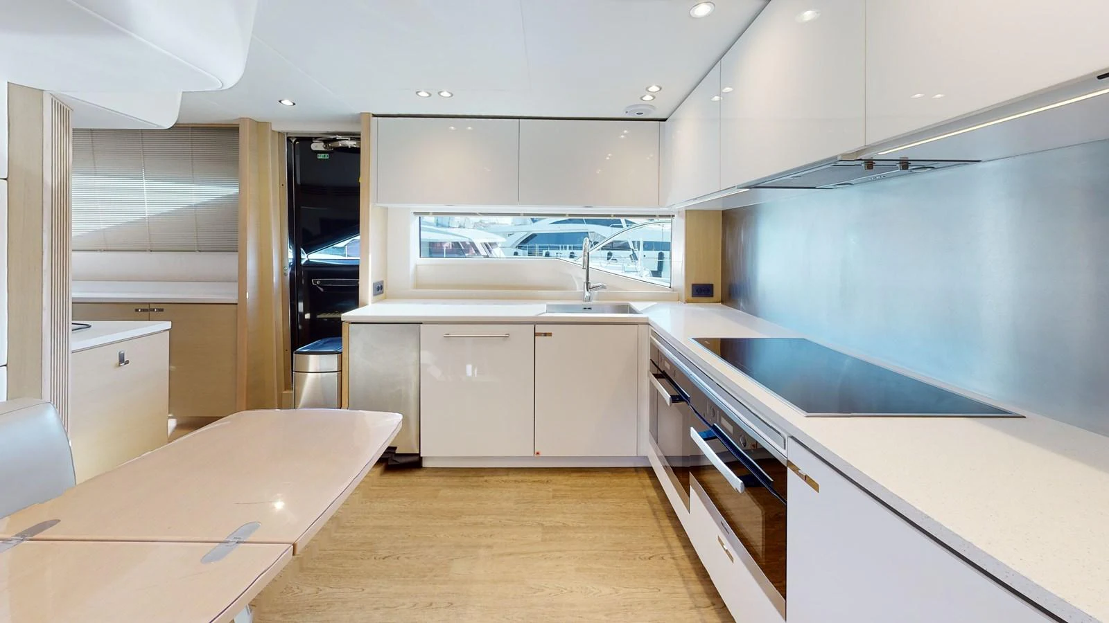 a kitchen with white cabinets aboard HALLELUJAH Yacht for Charter