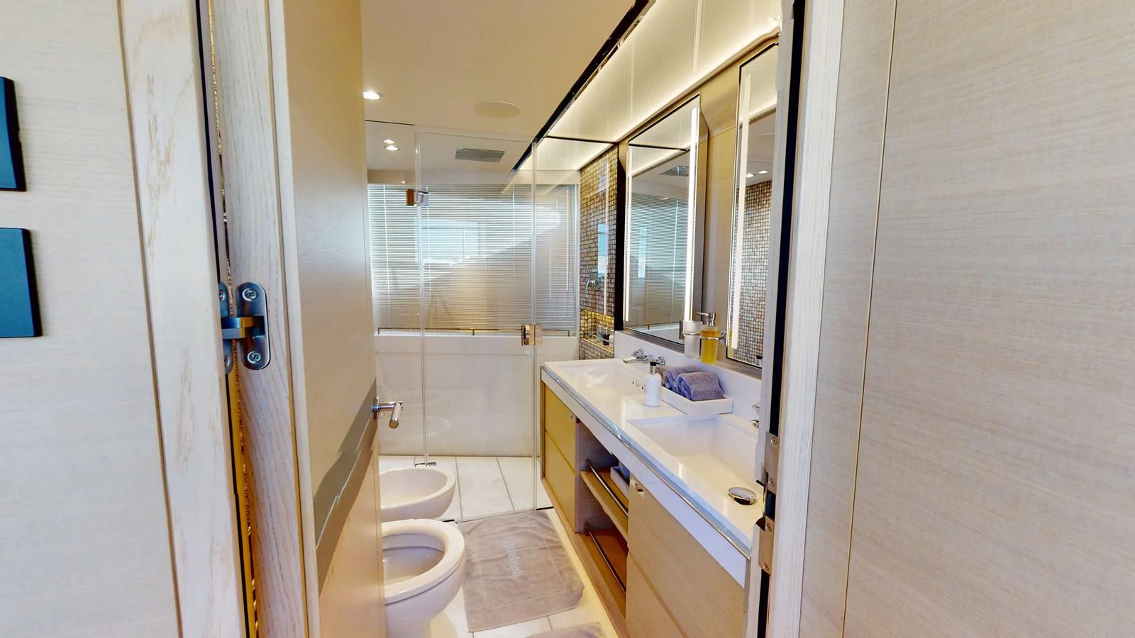 a bathroom with a sink and a mirror aboard HALLELUJAH Yacht for Charter