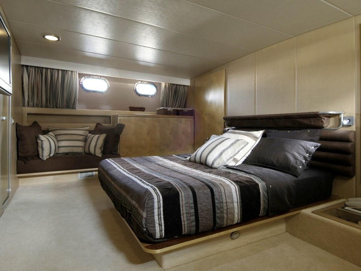 a bed in a room aboard CHATO Yacht for Sale