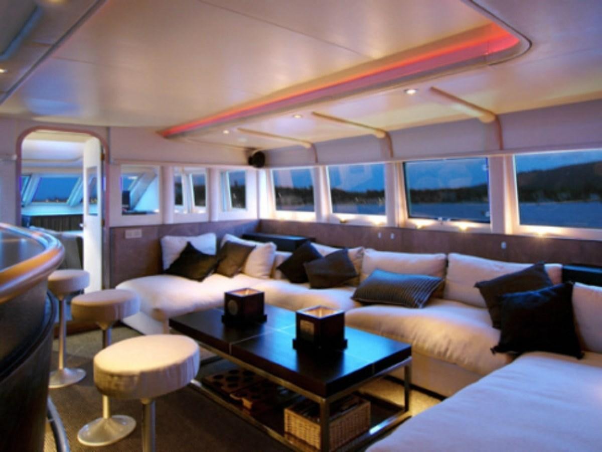 a room with a couch and a table aboard CHATO Yacht for Sale