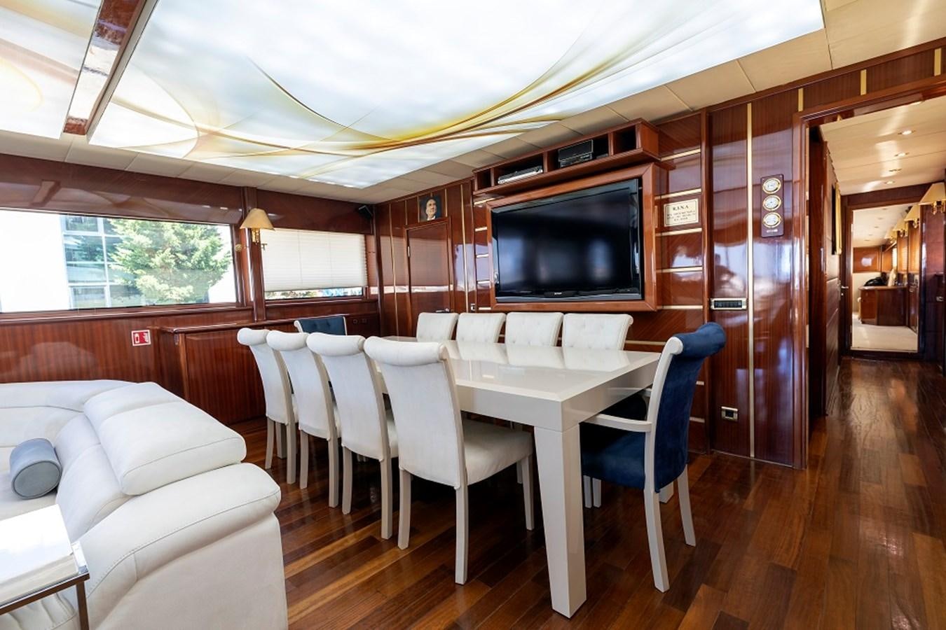 a large kitchen with a dining table aboard DENIZ Yacht for Sale
