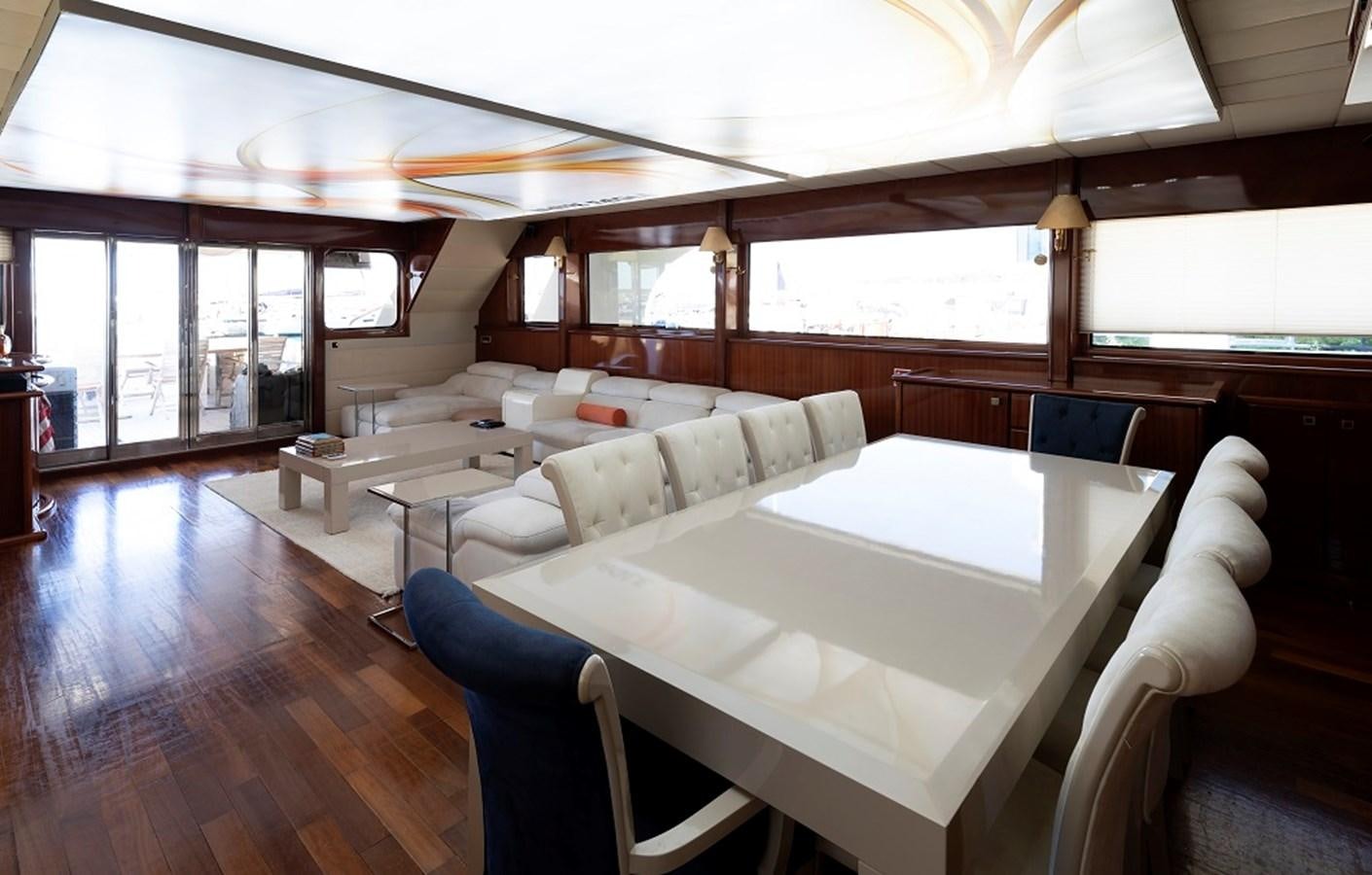 a room with a table chairs and a couch aboard DENIZ Yacht for Sale
