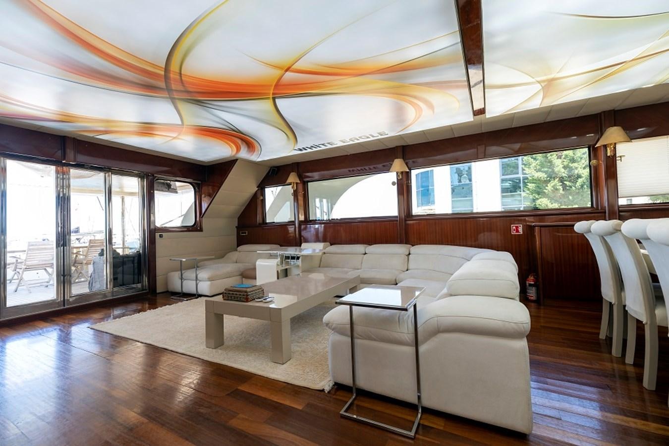 a living room with a large window aboard DENIZ Yacht for Sale