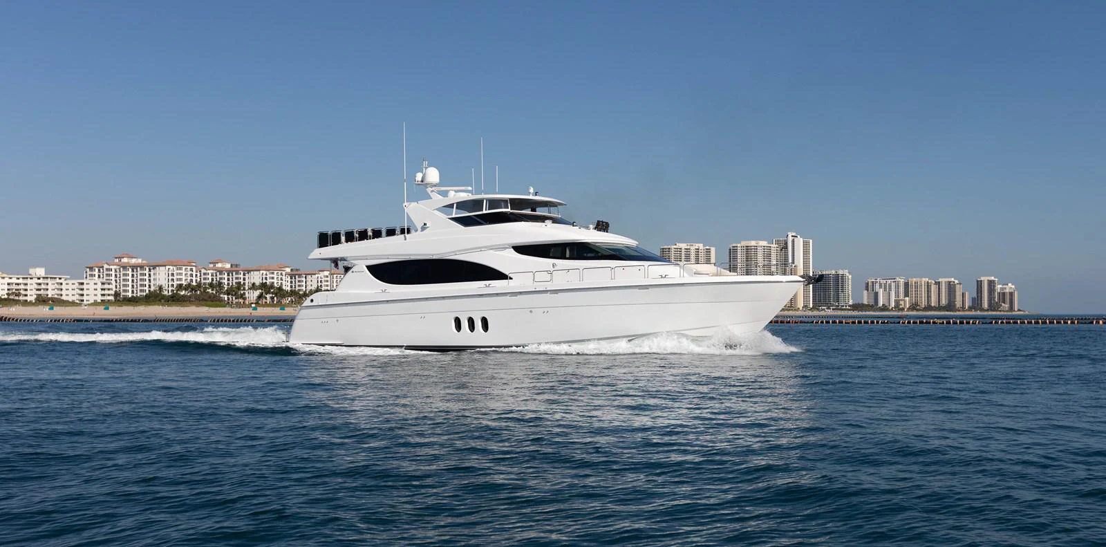 a white yacht on the water aboard CA'D'ZAN Yacht for Sale