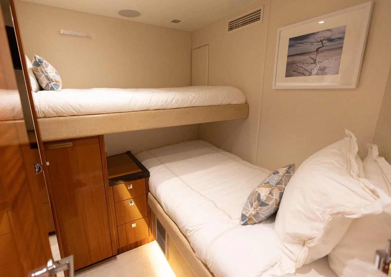 a bed with a white sheet aboard CA'D'ZAN Yacht for Sale