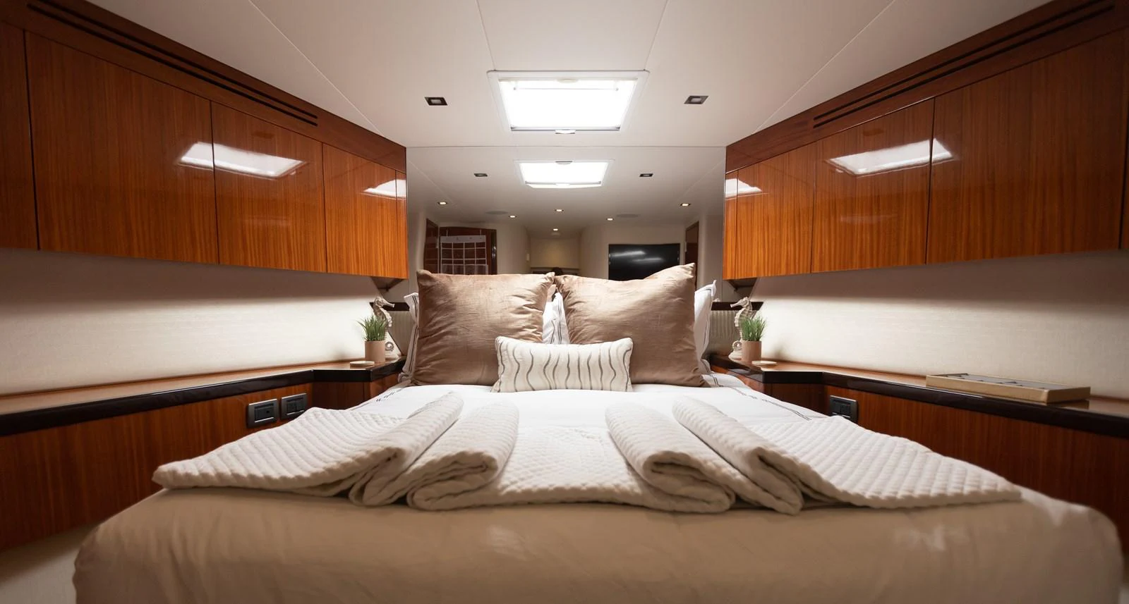 a bed with white sheets aboard CA'D'ZAN Yacht for Sale