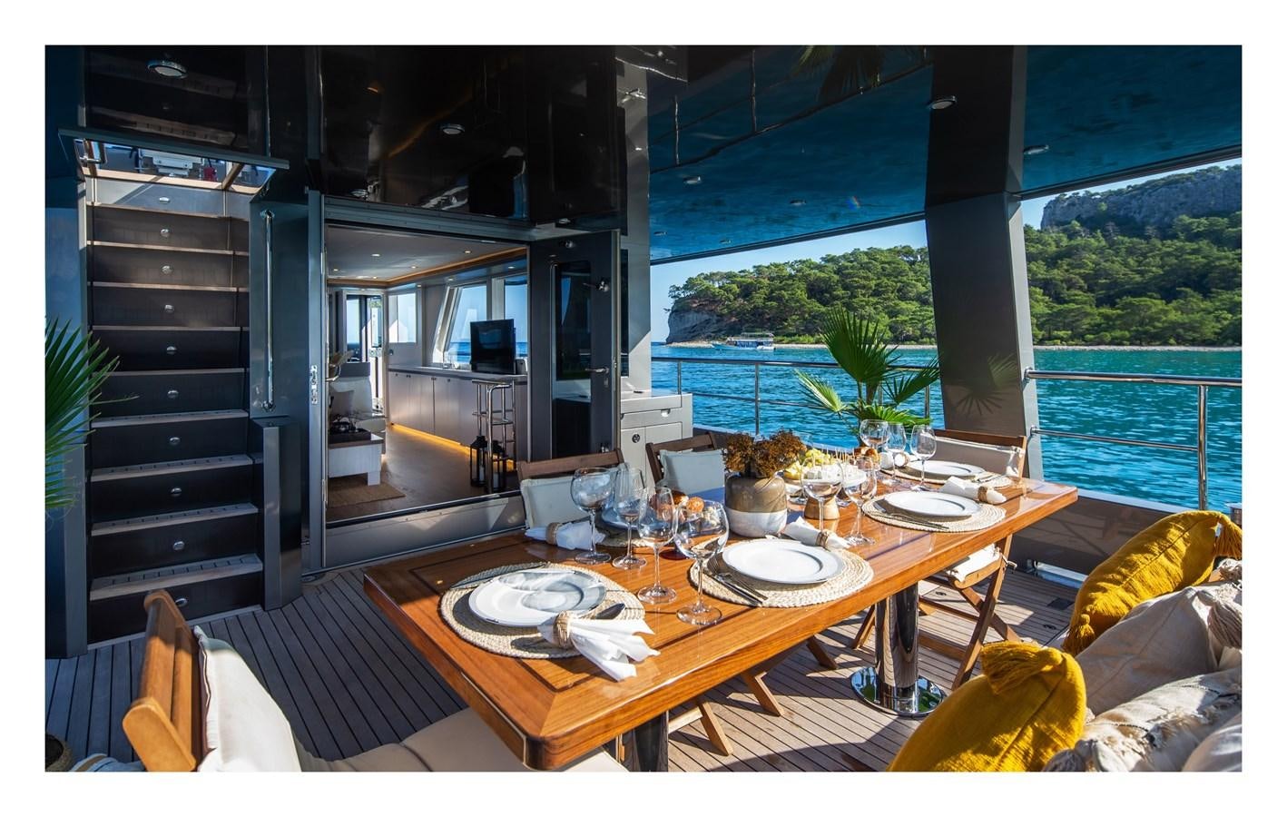 a dining table in a living room aboard BERING 70 RA Yacht for Sale