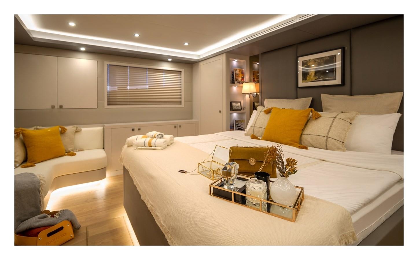 a bed with a white sheet and pillows aboard BERING 70 RA Yacht for Sale