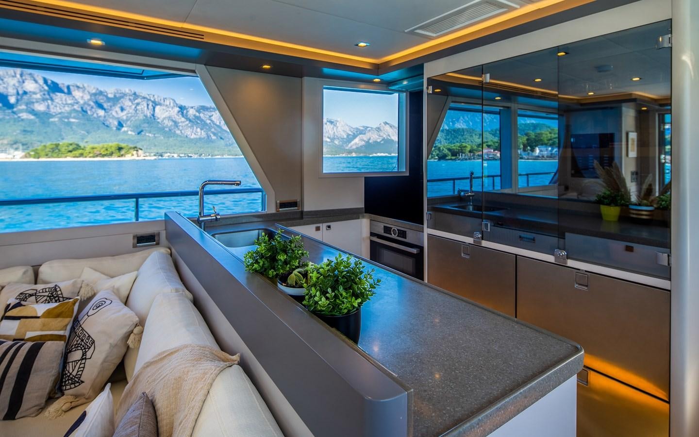 a kitchen with a large window aboard BERING 70 RA Yacht for Sale
