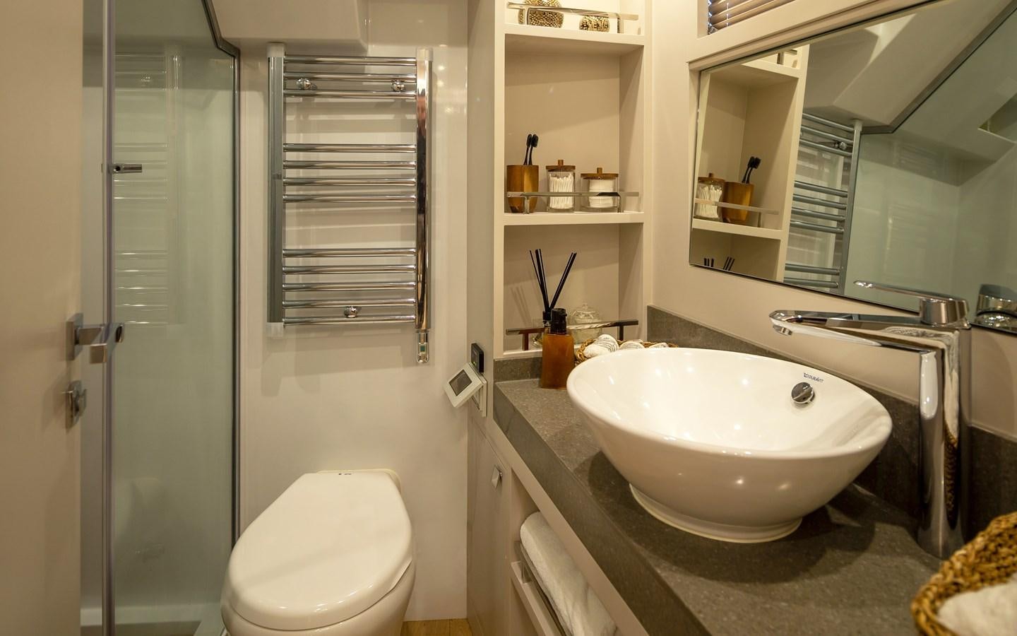 a bathroom with a sink and a shower unit aboard BERING 70 RA Yacht for Sale
