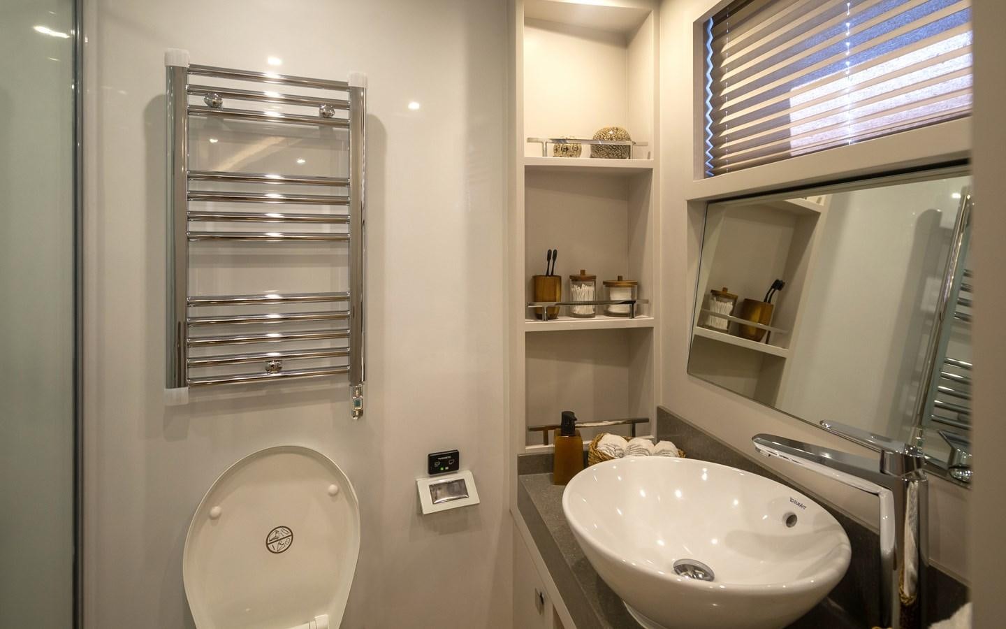 a bathroom with a sink and a mirror aboard BERING 70 RA Yacht for Sale