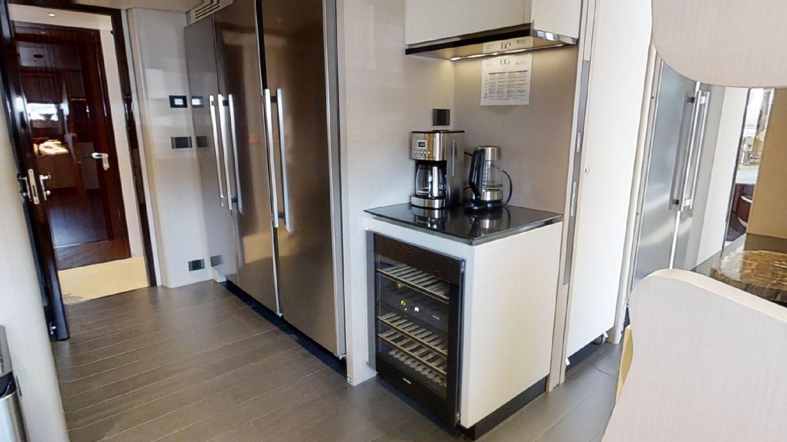 a kitchen with stainless steel appliances aboard VOLO MARE Yacht for Sale