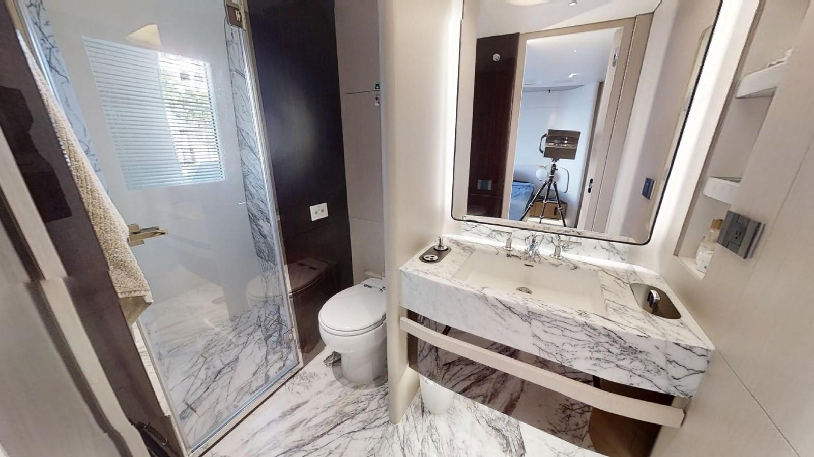 a bathroom with a tub sink and toilet aboard VOLO MARE Yacht for Sale