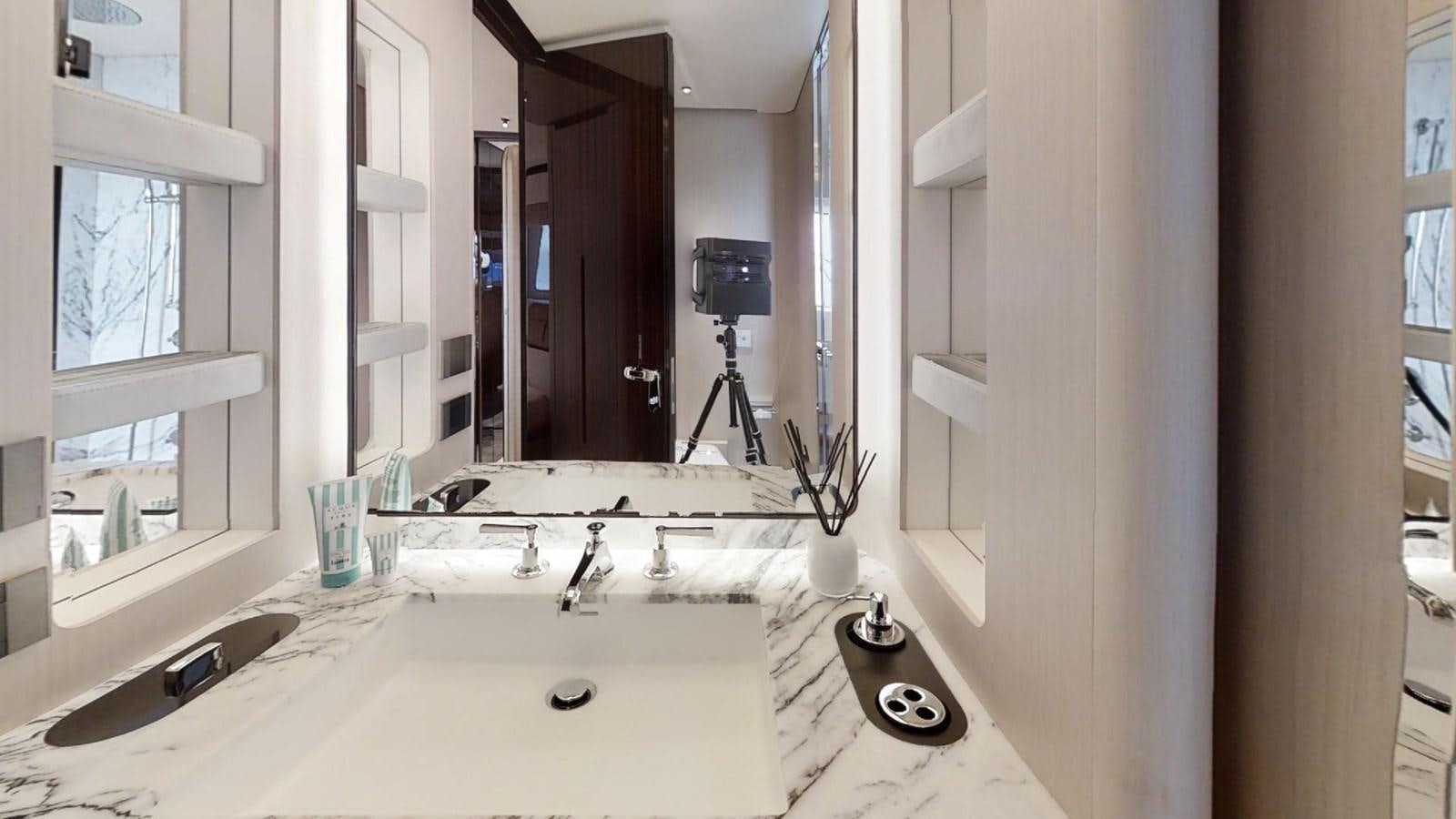 a bathroom with a large mirror aboard VOLO MARE Yacht for Sale