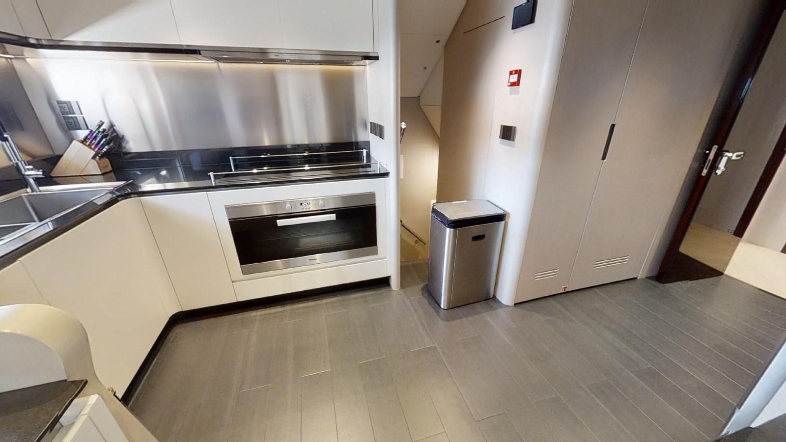 a kitchen with a stainless steel oven aboard VOLO MARE Yacht for Sale