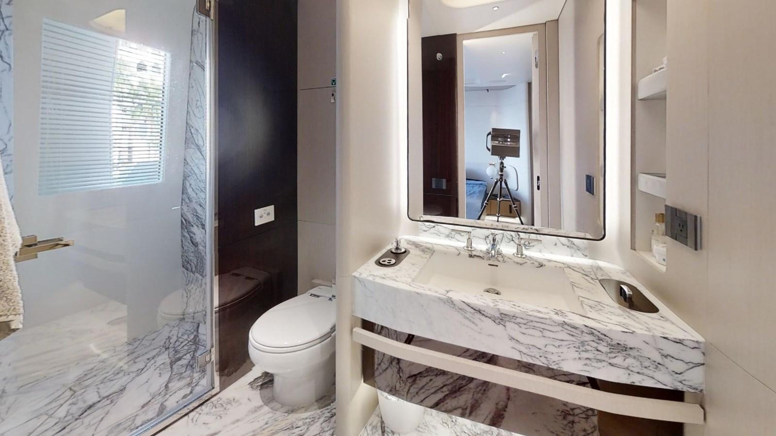 a bathroom with a sink and a mirror aboard VOLO MARE Yacht for Sale