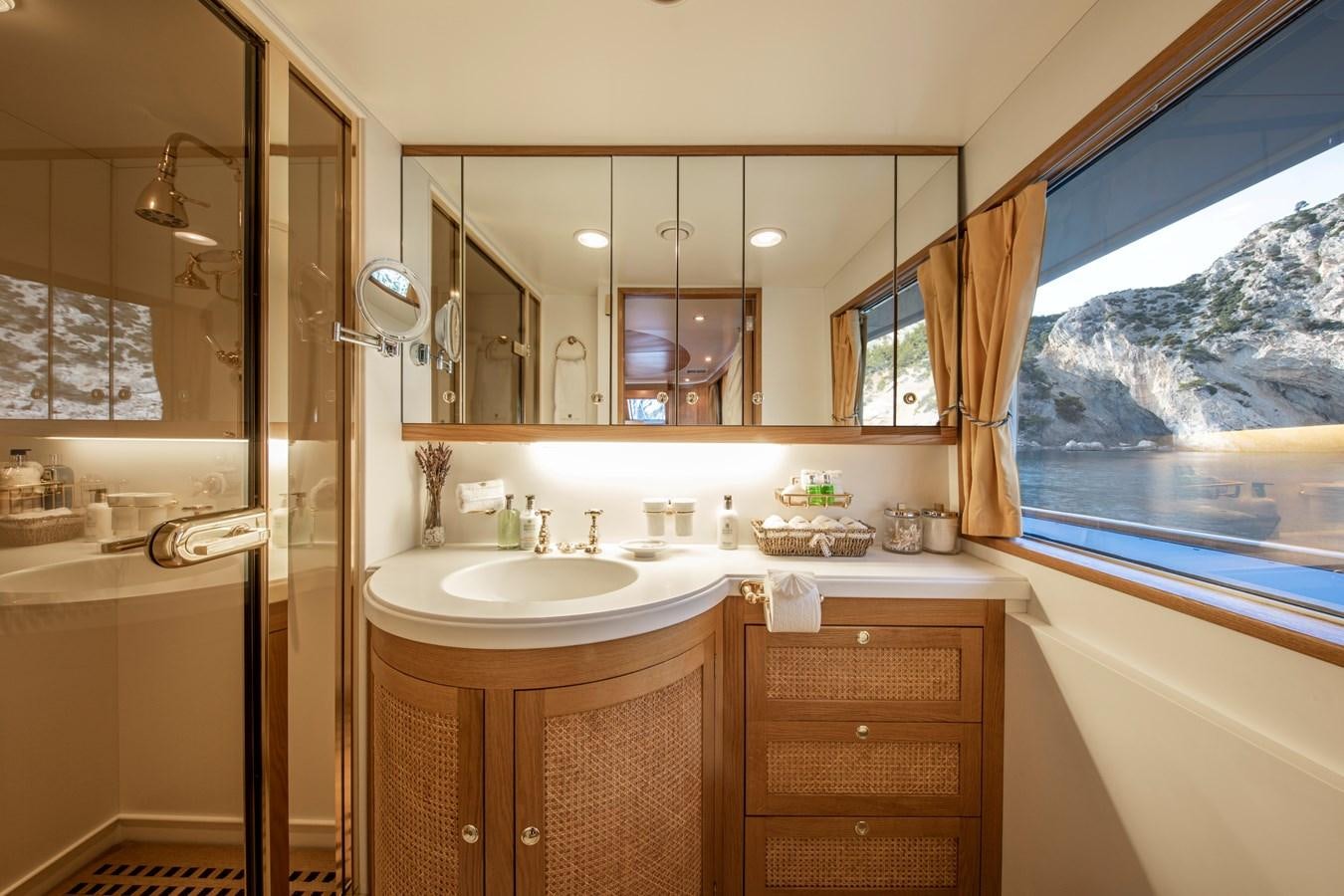 a bathroom with a large mirror aboard MONACO Yacht for Charter