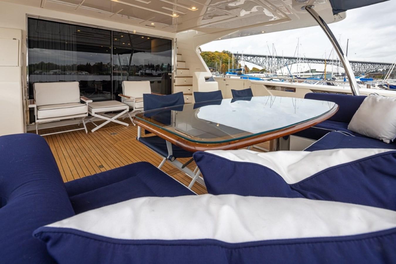 a boat with a deck and chairs aboard SOL SHINE Yacht for Sale